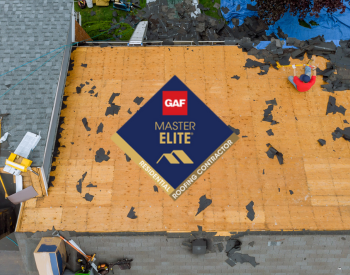 Professional roofers installing roof shingles during roof repair in Moore, Oklahoma